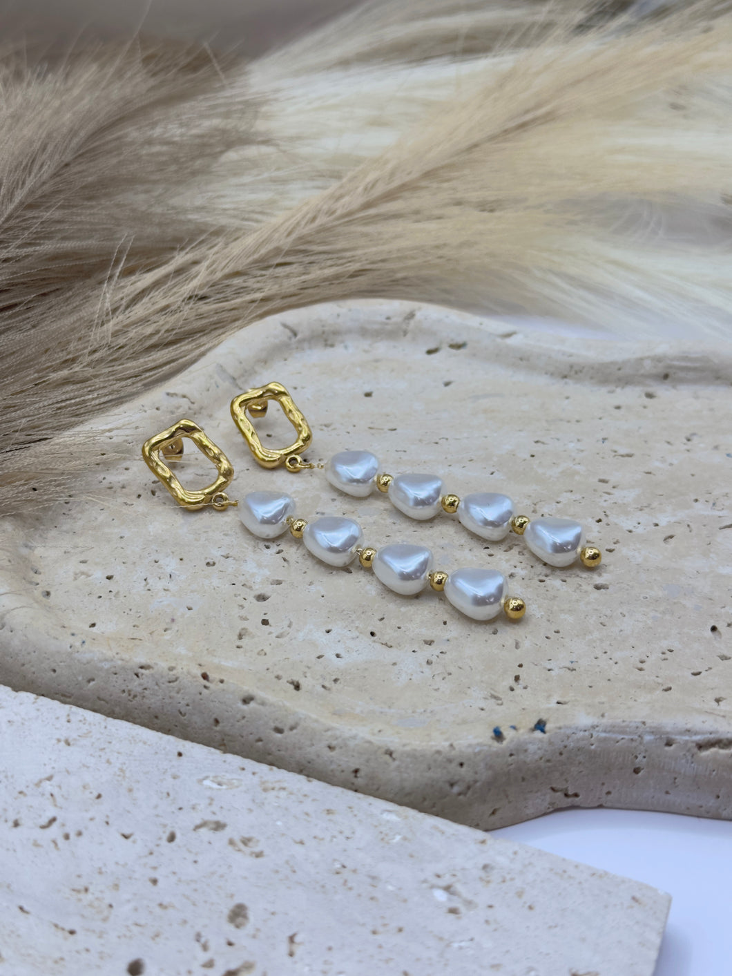 Aretes largos con perla