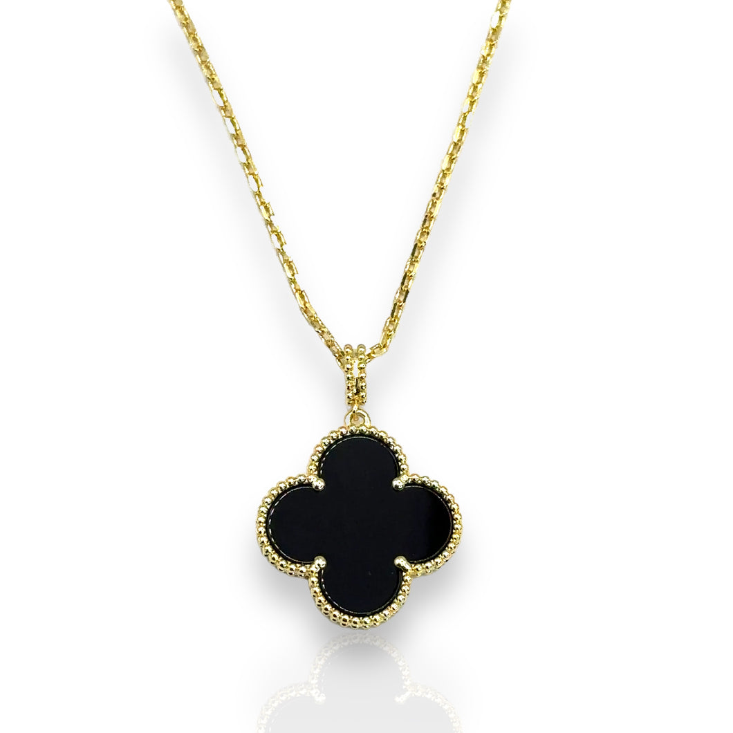 Clover negro de una flor con dorado